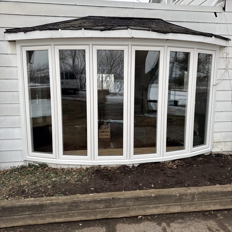 Modern multi-panel bay window replacement with high-performance glass.