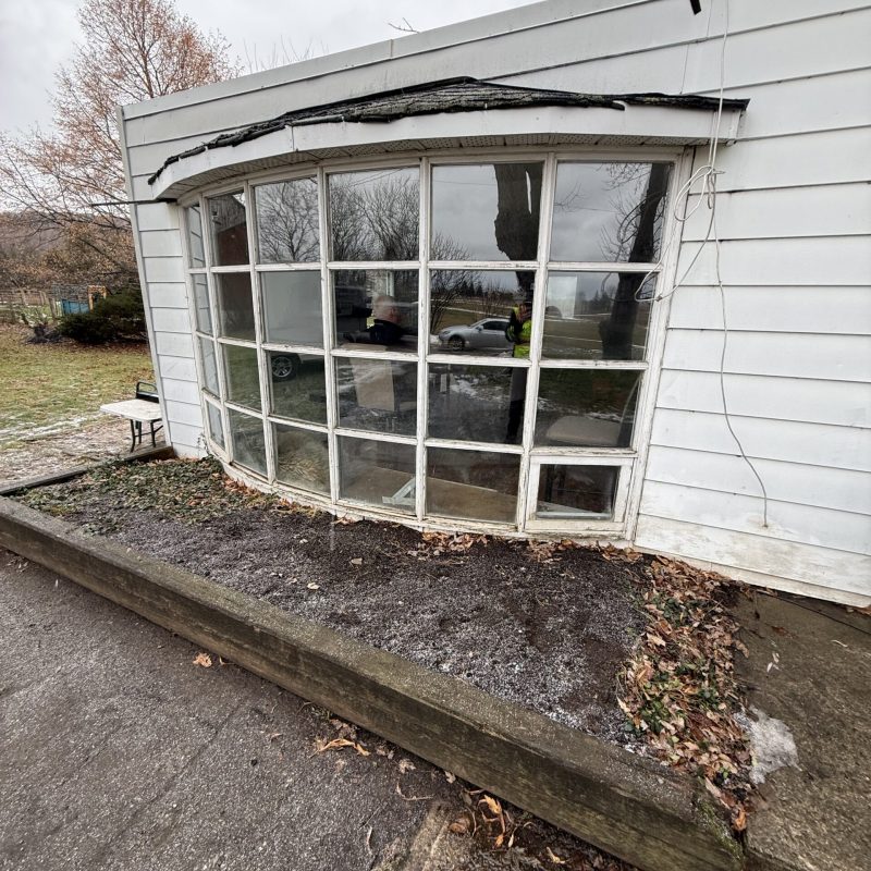 Original bay window with failed thermal seals and foggy glass panes.