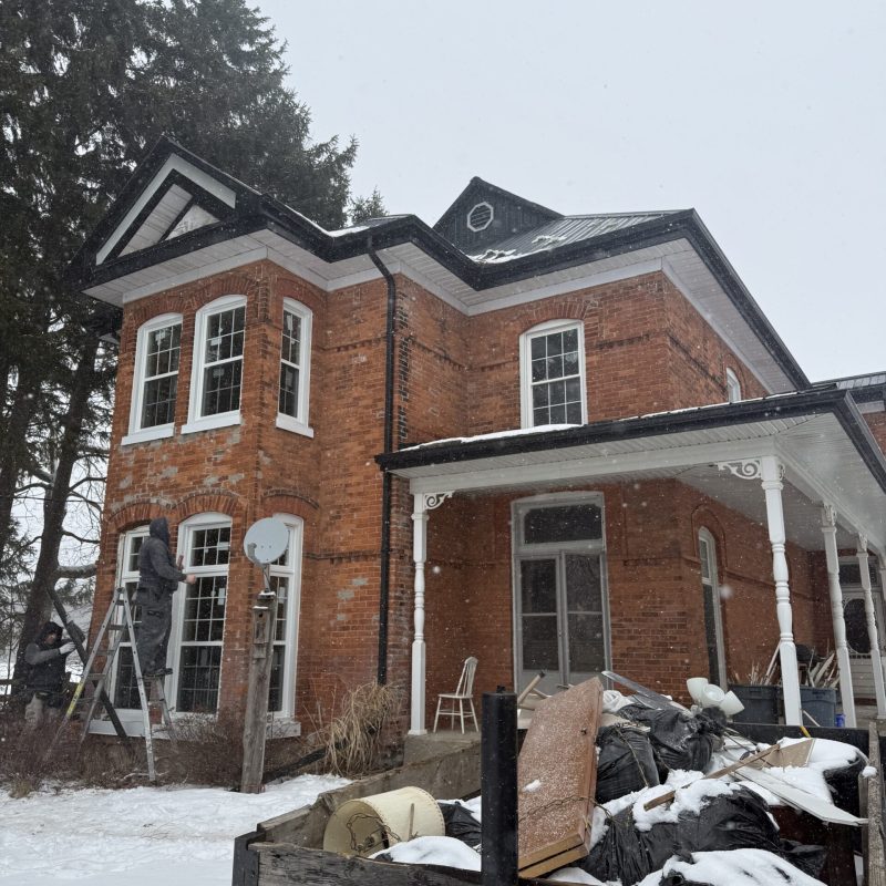 New energy-efficient windows installed in heritage red brick home.